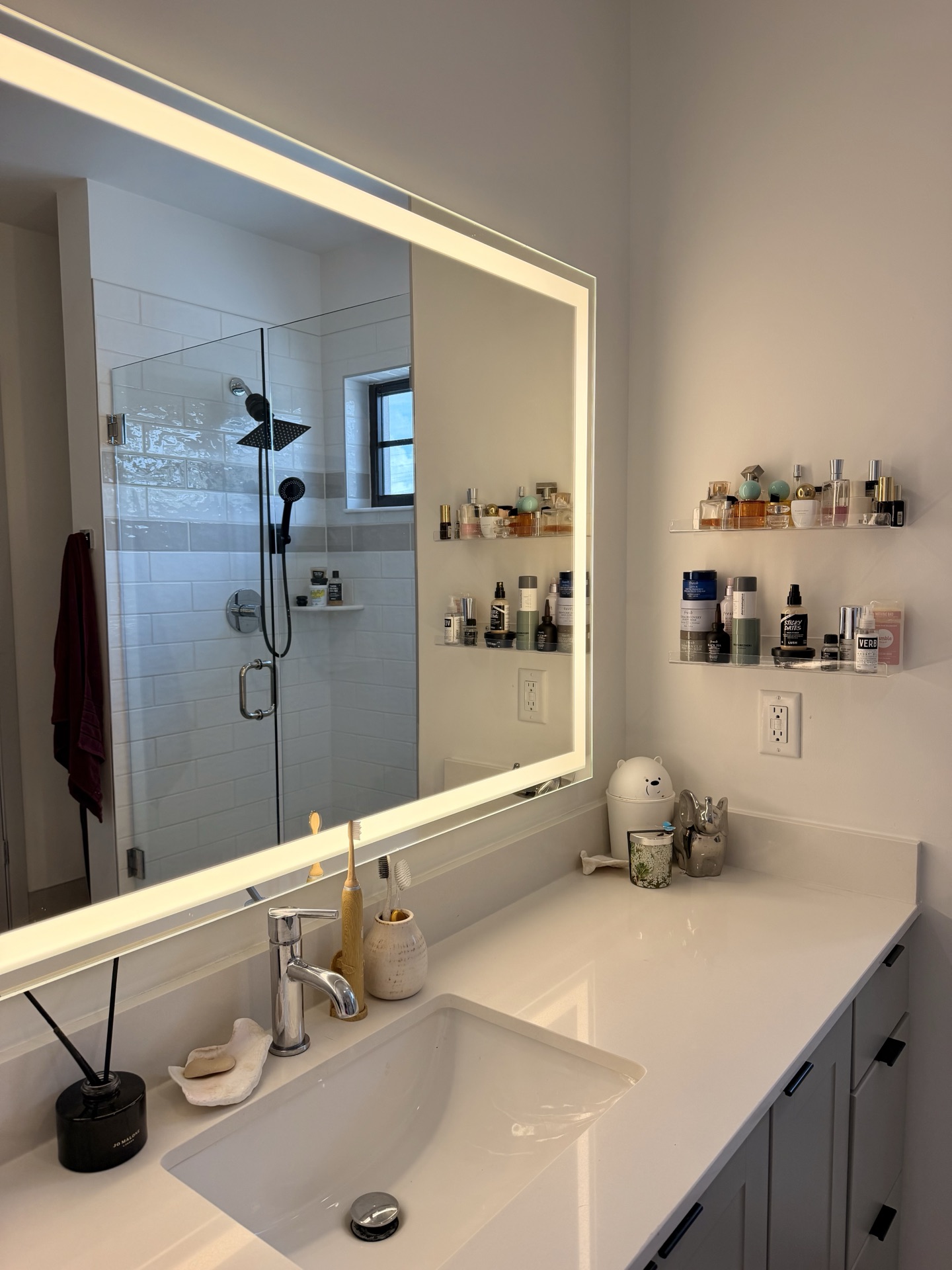 Vanity with LED mirror and skincare shelves