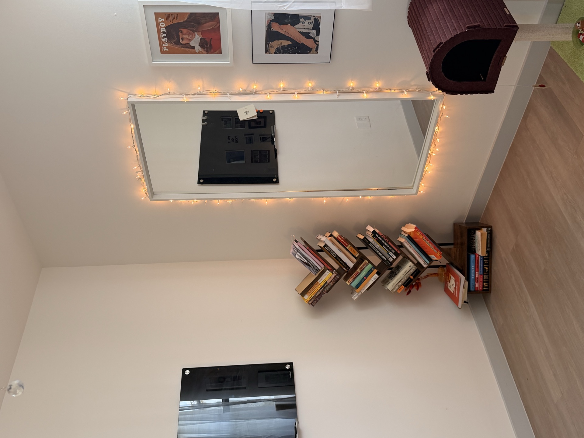Office corner with bookshelf and lighted mirror